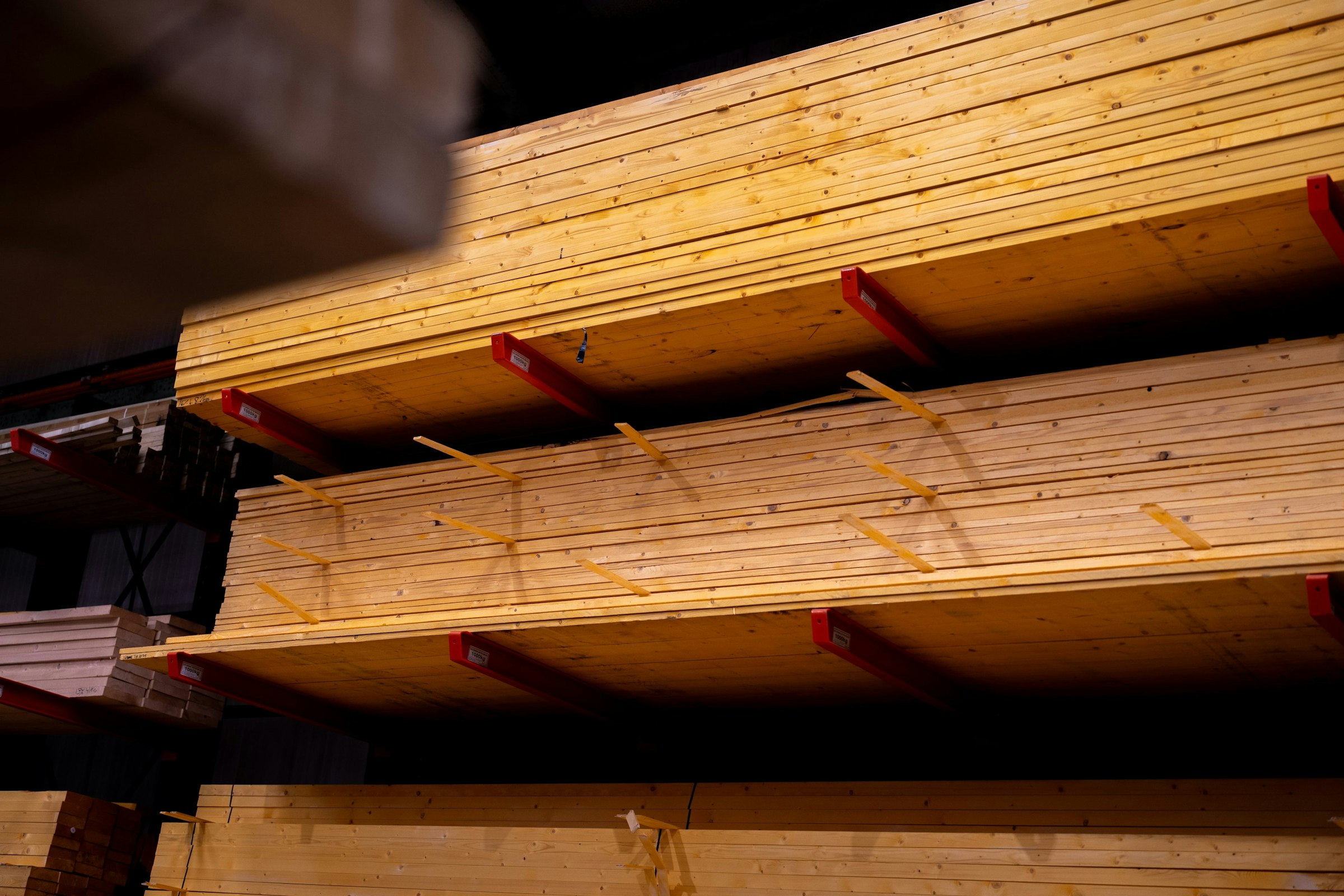 Stacked lumber on cantilever racks in a building products warehouse